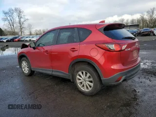 2014 Mazda CX-5 Touring с VIN JM3KE2CY3E0308740, выставлен на аукционе Copart как лот 88127365 с пробегом 137 690 миль миль и Списание • Salvage title. История ставок и продаж доступна на DreamBid. Изображение 2.
