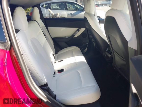 2020 Tesla Model Y Long Range with VIN 5YJYGDEE8LF057014, listed as a IAAI auction lot 41988113 with 18,246 mi miles and . Bid and sale history available at DreamBid. Image 8.