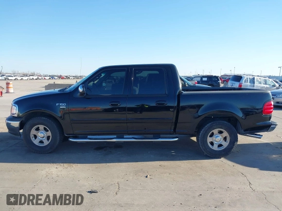 2002 Ford F-150 XLT with VIN 1FTRW07622KD31203, listed as a IAAI auction lot 41401506 with 166,949 mi miles. Bid and sale history available at carsss.com. Image 14.