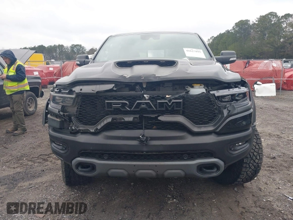 2022 Ram 1500 TRX with VIN 1C6SRFU9XNN476106, listed as a IAAI auction lot 41627895 with 21,992 mi miles and . Bid and sale history available at DreamBid. Image 12.
