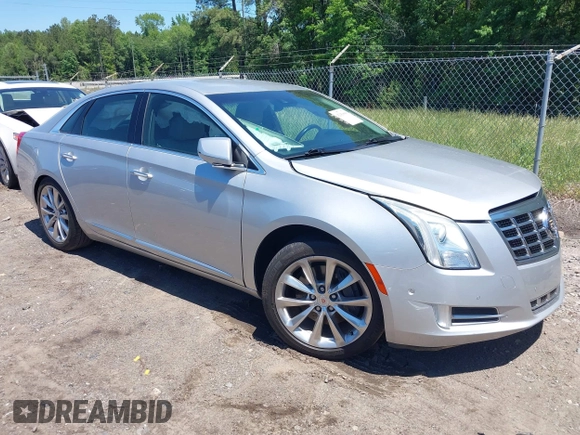 2014 Cadillac XTS Luxury z VIN 2G61M5S31E9199170, wystawiony jako IAAI lot #42150000 z przebiegiem 135 414 mil mil oraz . Historia ofert i sprzedaży dostępna na DreamBid. Obrazek 1.