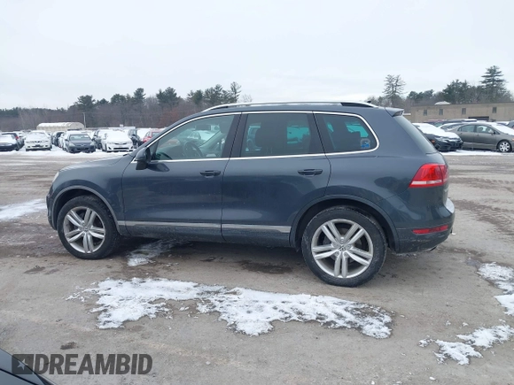2012 Volkswagen Touareg Sport z VIN WVGEF9BP4CD008517, wystawiony jako IAAI lot #41386971 z przebiegiem 179 306 mil mil oraz . Historia ofert i sprzedaży dostępna na DreamBid. Obrazek 14.