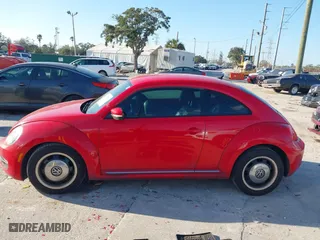 2012 Volkswagen Beetle 2.5L with VIN 3VWJX7AT5CM648739, listed as a IAAI auction lot 41547850 with 214,941 mi miles. Bid and sale history available at carsss.com. Image 14.