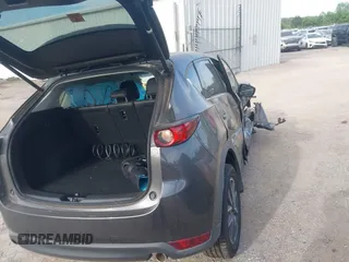 2018 Mazda CX-5 Grand Touring z VIN JM3KFADM5J1365772, wystawiony jako IAAI lot #42251805 z przebiegiem 44 599 mil mil oraz . Historia ofert i sprzedaży dostępna na DreamBid. Obrazek 4.