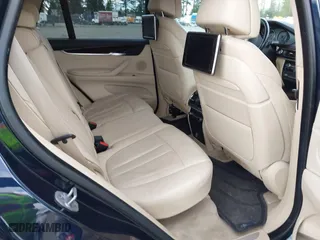 2015 BMW X5 xDrive35d with VIN 5UXKS4C55F0J98874, listed as a IAAI auction lot 42030583 with 151,079 mi miles. Bid and sale history available at carsss.com. Image 8.