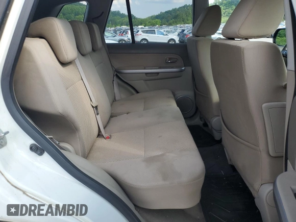 2010 Suzuki Grand Vitara Premium z VIN JS3TD0D24A4100983, wystawiony jako Copart lot #60311295 z przebiegiem 104 455 mil mil oraz Szkoda całkowita • Salvage title. Historia ofert i sprzedaży dostępna na DreamBid. Obrazek 11.