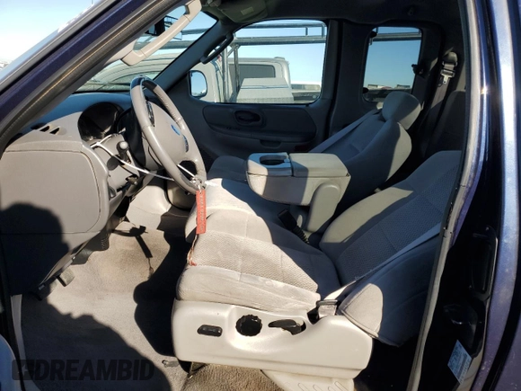 2003 Ford F-150 XL with VIN 1FTRX17L13NA95202, listed as a Copart auction lot 87766385 with 124,961 mi miles and Salvage Title. Bid and sale history available at carsss.com. Image 7.