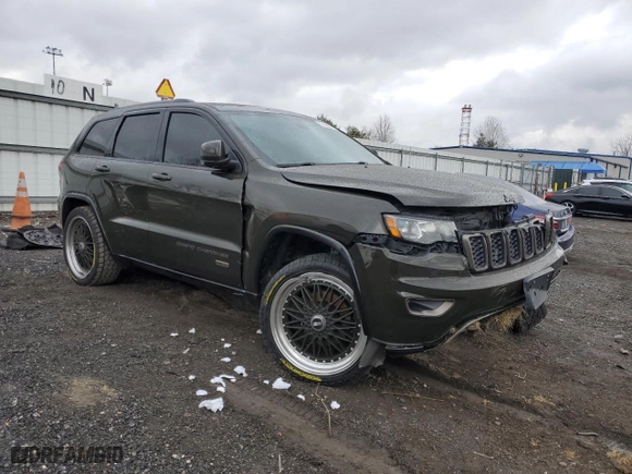 2016 Jeep Grand Cherokee Limited 75th Anniversary with VIN 1C4RJFBG5GC441102, listed as a Copart auction lot 87450344 with 130,811 mi miles and Salvage Title. Bid and sale history available at carsss.com. Image 4.