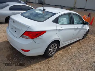 2014 Hyundai Accent GLS z VIN KMHCT4AE5EU697201, wystawiony jako IAAI lot #42157098 z przebiegiem 139 181 mil mil oraz . Historia ofert i sprzedaży dostępna na DreamBid. Obrazek 4.