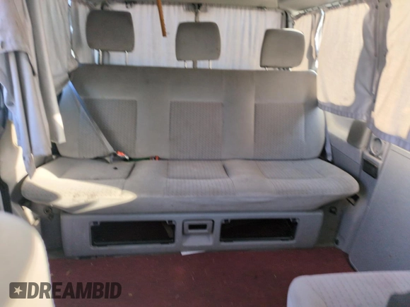 2003 Volkswagen EuroVan MV с VIN WV2NB47083H002700, выставлен на аукционе Copart как лот 76117874 с пробегом 186 942 миль миль и На запчасти • Non repairable. История ставок и продаж доступна на DreamBid. Изображение 10.