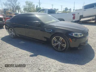 2014 BMW M5 z VIN WBSFV9C52ED593005, wystawiony jako Copart lot #49054395 z przebiegiem 71 213 mil mil oraz Szkoda całkowita • Salvage title. Historia ofert i sprzedaży dostępna na DreamBid. Obrazek 4.