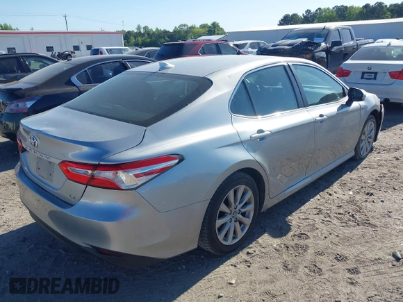 2019 Toyota Camry LE z VIN 4T1B11HK7KU756675, wystawiony jako IAAI lot #42063923 z przebiegiem 132 312 mil mil oraz . Historia ofert i sprzedaży dostępna na DreamBid. Obrazek 4.