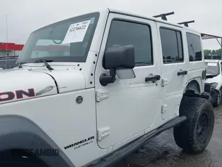 2014 Jeep Wrangler Unlimited Rubicon with VIN 1C4HJWFG4EL104827, listed as a IAAI auction lot 42236622 with 90,935 mi miles and . Bid and sale history available at DreamBid. Image 6.