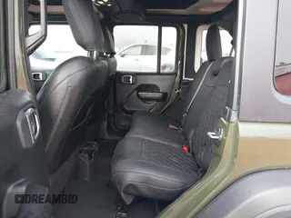 2021 Jeep Wrangler Unlimited Willys with VIN 1C4HJXDM1MW812674, listed as a IAAI auction lot 41670637 with 59,241 mi miles and . Bid and sale history available at DreamBid. Image 8.