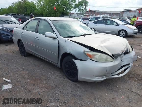 2004 Toyota Camry LE with VIN 4T1BE32K84U374943, listed as a IAAI auction lot 42038382 with 323,419 mi miles. Bid and sale history available at carsss.com. Image 1.