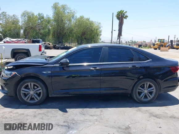 2019 Volkswagen Jetta S z VIN 3VWC57BU1KM116991, wystawiony jako IAAI lot #42377777 z przebiegiem 70 910 mil mil oraz . Historia ofert i sprzedaży dostępna na DreamBid. Obrazek 14.