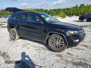 2018 Jeep Grand Cherokee Laredo E with VIN 1C4RJEAGXJC246874, listed as a Copart auction lot 56722005 with 101,493 mi miles and Salvage title. Bid and sale history available at DreamBid. Image 4.