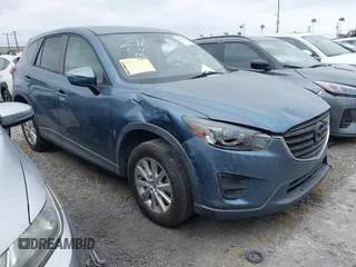 2016 Mazda CX-5 Touring z VIN JM3KE2CY2G0699138, wystawiony jako IAAI lot #42153228 z przebiegiem 144 191 mil mil oraz . Historia ofert i sprzedaży dostępna na DreamBid. Obrazek 1.