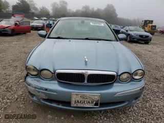 2004 Jaguar X-Type with VIN SAJEA51C04WD73149, listed as a Copart auction lot 74020364 with 118,034 mi miles and Salvage Title. Bid and sale history available at carsss.com. Image 5.