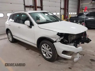 2014 Volkswagen Touareg Sport with VIN WVGEF9BP6ED005007, listed as a IAAI auction lot 41757033 with Not Provided miles and . Bid and sale history available at DreamBid. Image 1.