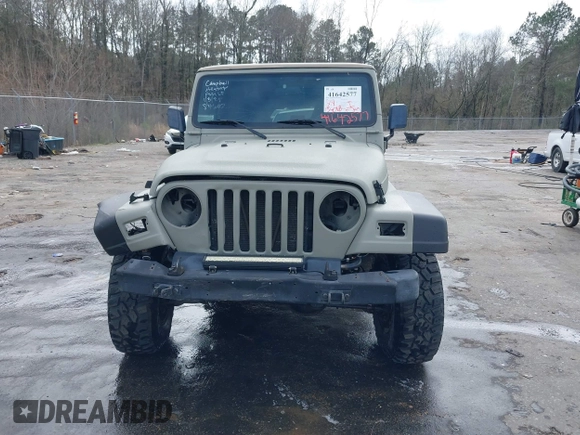 1999 Jeep Wrangler Sahara with VIN 1J4FY49S0XP480017, listed as a IAAI auction lot 41642577 with 154,068 mi miles. Bid and sale history available at carsss.com. Image 12.