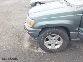 2002 Jeep Grand Cherokee Laredo with VIN 1J4GW48NX2C151430, listed as a IAAI auction lot 41886769 with 222,795 mi miles. Bid and sale history available at carsss.com. Image 6.