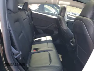 2023 Tesla Model Y Long Range with VIN 7SAYGDEE5PF850358, listed as a Copart auction lot 52581615 with 19,376 mi miles and Salvage Title. Bid and sale history available at DreamBid. Image 11.