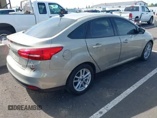 2015 Ford Focus SE z VIN 1FADP3F29FL206003, wystawiony jako IAAI lot #42187898 z przebiegiem 149 560 mil mil oraz . Historia ofert i sprzedaży dostępna na DreamBid. Obrazek 4.