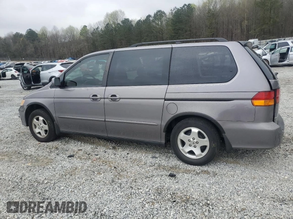 2000 Honda Odyssey EX with VIN 2HKRL1865YH513885, listed as a Copart auction lot 50223505 with 214,627 mi miles and Salvage Title. Bid and sale history available at DreamBid. Image 2.