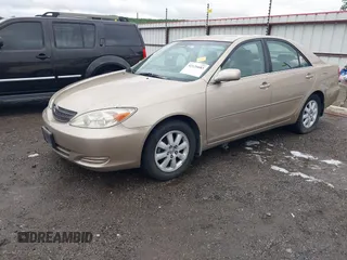 2002 Toyota Camry LE z VIN 4T1BE32K52U086150, wystawiony jako IAAI lot #42126685 z przebiegiem 175 212 mil mil oraz . Historia ofert i sprzedaży dostępna na DreamBid. Obrazek 17.