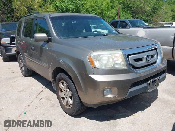 2011 Honda Pilot Touring with VIN 5FNYF4H94BB021952, listed as a IAAI auction lot 41985940 with 170,043 mi miles. Bid and sale history available at carsss.com. Image 1.