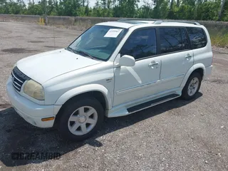 2002 Suzuki XL7 Standard z VIN JS3TY92V624101978, wystawiony jako IAAI lot #42399967 z przebiegiem 179 364 mil mil oraz . Historia ofert i sprzedaży dostępna na DreamBid. Obrazek 2.