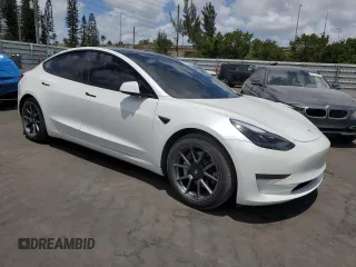2021 Tesla Model 3 Standard Range Plus with VIN 5YJ3E1EA2MF985463, listed as a Copart auction lot 53311455 with 23,176 mi miles and Clean Title. Bid and sale history available at DreamBid. Image 4.