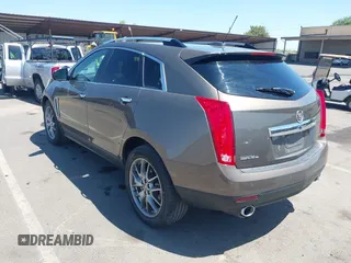2015 Cadillac SRX Performance Collection with VIN 3GYFNFE35FS569682, listed as a IAAI auction lot 42322229 with 124,365 mi miles and . Bid and sale history available at DreamBid. Image 3.
