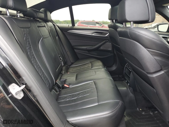 2018 BMW 5 Series M550i xDrive with VIN WBAJB9C51JB286700, listed as a Copart auction lot 64681004 with 76,304 mi miles and Salvage Title. Bid and sale history available at carsss.com. Image 10.