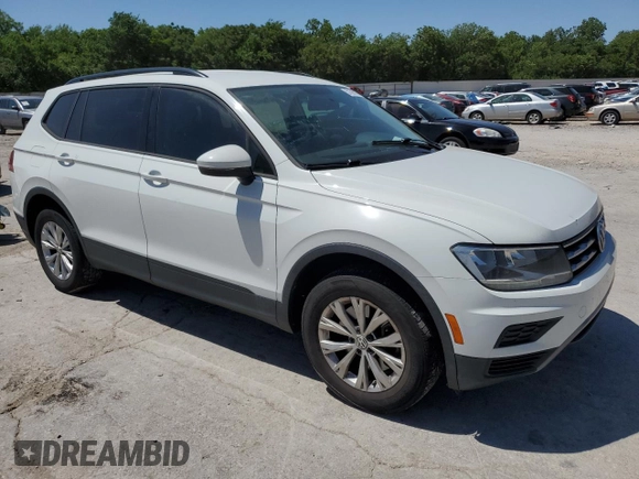 2018 Volkswagen Tiguan S with VIN 3VV0B7AX7JM065958, listed as a Copart auction lot 57598015 with 97,360 mi miles and Salvage title. Bid and sale history available at DreamBid. Image 4.