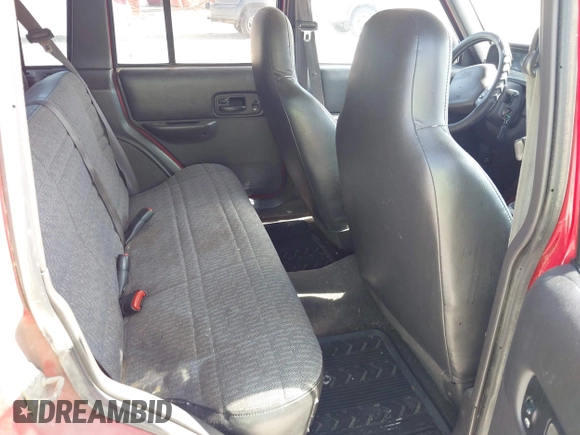 2001 Jeep Cherokee Sport z VIN 1J4FT48S01L508039, wystawiony jako IAAI lot #42743009 z przebiegiem 200 074 mil mil oraz . Historia ofert i sprzedaży dostępna na DreamBid. Obrazek 8.