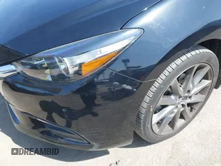 2018 Mazda 3 Touring z VIN 3MZBN1V33JM276803, wystawiony jako IAAI lot #42100422 z przebiegiem 41 802 mil mil oraz . Historia ofert i sprzedaży dostępna na DreamBid. Obrazek 18.