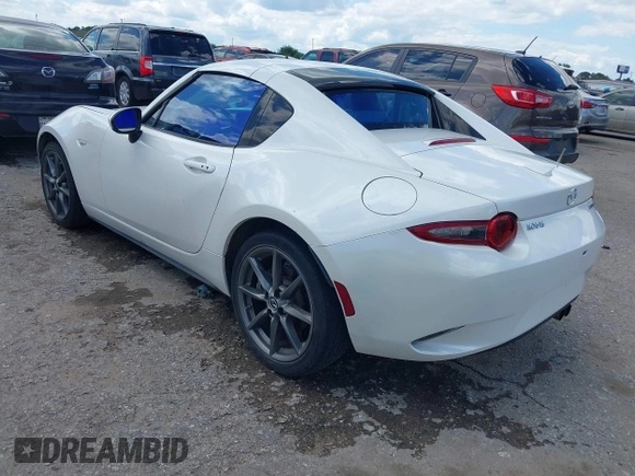2020 Mazda MX-5 Miata Grand Touring z VIN JM1NDAM79L0411456, wystawiony jako IAAI lot #42229479 z przebiegiem 63 508 mil mil oraz . Historia ofert i sprzedaży dostępna na DreamBid. Obrazek 3.