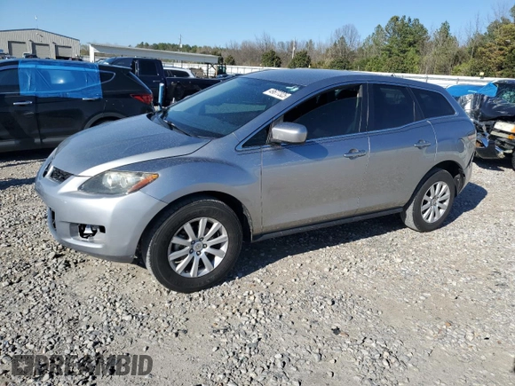 2012 Mazda CX-7 i SV z VIN JM3ER2A5XC0419471, wystawiony jako Copart lot #49677325 z przebiegiem 112 551 mil mil oraz Czysty tytuł • Clean title. Historia ofert i sprzedaży dostępna na DreamBid. Obrazek 1.