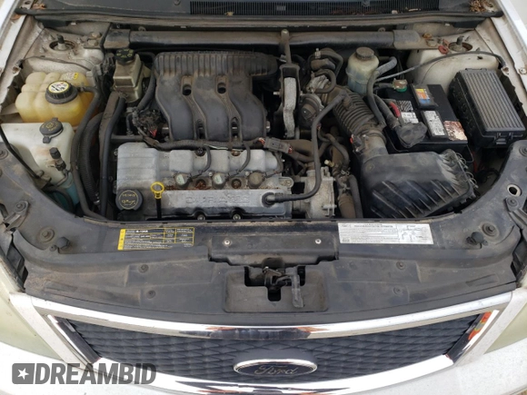 2005 Ford Five Hundred SE z VIN 1FAFP231X5G165841, wystawiony jako Copart lot #43117535 z przebiegiem 154 874 mil mil oraz Czysty tytuł • Clean title. Historia ofert i sprzedaży dostępna na DreamBid. Obrazek 11.