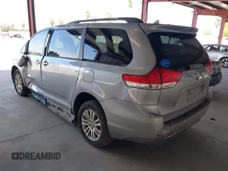 2011 Toyota Sienna XLE AAS with VIN 5TDYK3DC0BS107522, listed as a IAAI auction lot 42207305 with 171,857 mi miles and . Bid and sale history available at DreamBid. Image 3.