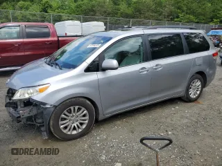 2011 Toyota Sienna XLE AAS with VIN 5TDYK3DC1BS165154, listed as a Copart auction lot 57044235 with 232,461 mi miles and Salvage title. Bid and sale history available at DreamBid. Image 1.