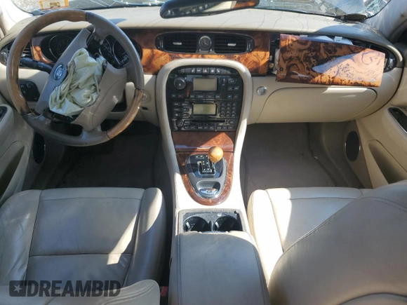 2004 Jaguar XJ with VIN SAJEA71C74SG02851, listed as a Copart auction lot 69056994 with 0 mi miles and Salvage Title. Bid and sale history available at carsss.com. Image 7.