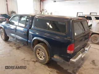 2003 Dodge Dakota SLT with VIN 1D7HL48N63S177233, listed as a IAAI auction lot 42167711 with 163,511 mi miles and . Bid and sale history available at carsss.com. Image 3.