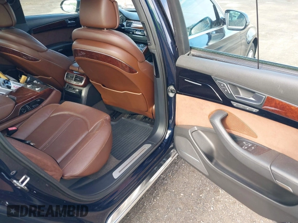 2011 Audi A8 with VIN WAURVAFD4BN018884, listed as a IAAI auction lot 42693000 with 116,952 mi miles and . Bid and sale history available at DreamBid. Image 8.