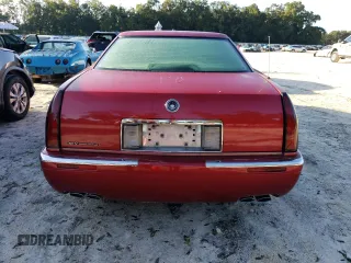 1998 Cadillac Eldorado z VIN 1G6EL12Y4WU610896, wystawiony jako Copart lot #74662244 z przebiegiem Nie podano mil oraz Szkody całkowita. Historia ofert i sprzedaży dostępna na DreamBid. Obrazek 6.