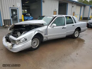 1997 Lincoln Town Car Executive with VIN 1LNLM81W1VY719314, listed as a Copart auction lot 73950324 with 0 mi miles and Salvage Title. Bid and sale history available at carsss.com. Image 1.