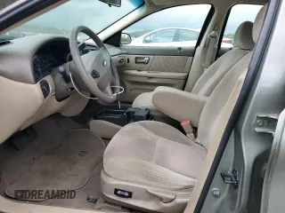 2002 Ford Taurus SE Standard z VIN 1FAFP53U92A246842, wystawiony jako Copart lot #57858765 z przebiegiem 64 545 mil mil oraz Tytuł czysty. Historia ofert i sprzedaży dostępna na DreamBid. Obrazek 7.