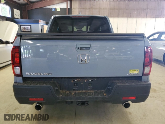 2023 Honda Ridgeline RTL-E with VIN 5FPYK3F77PB001460, listed as a Copart auction lot 61383785 with 27,423 mi miles and Salvage title. Bid and sale history available at DreamBid. Image 6.
